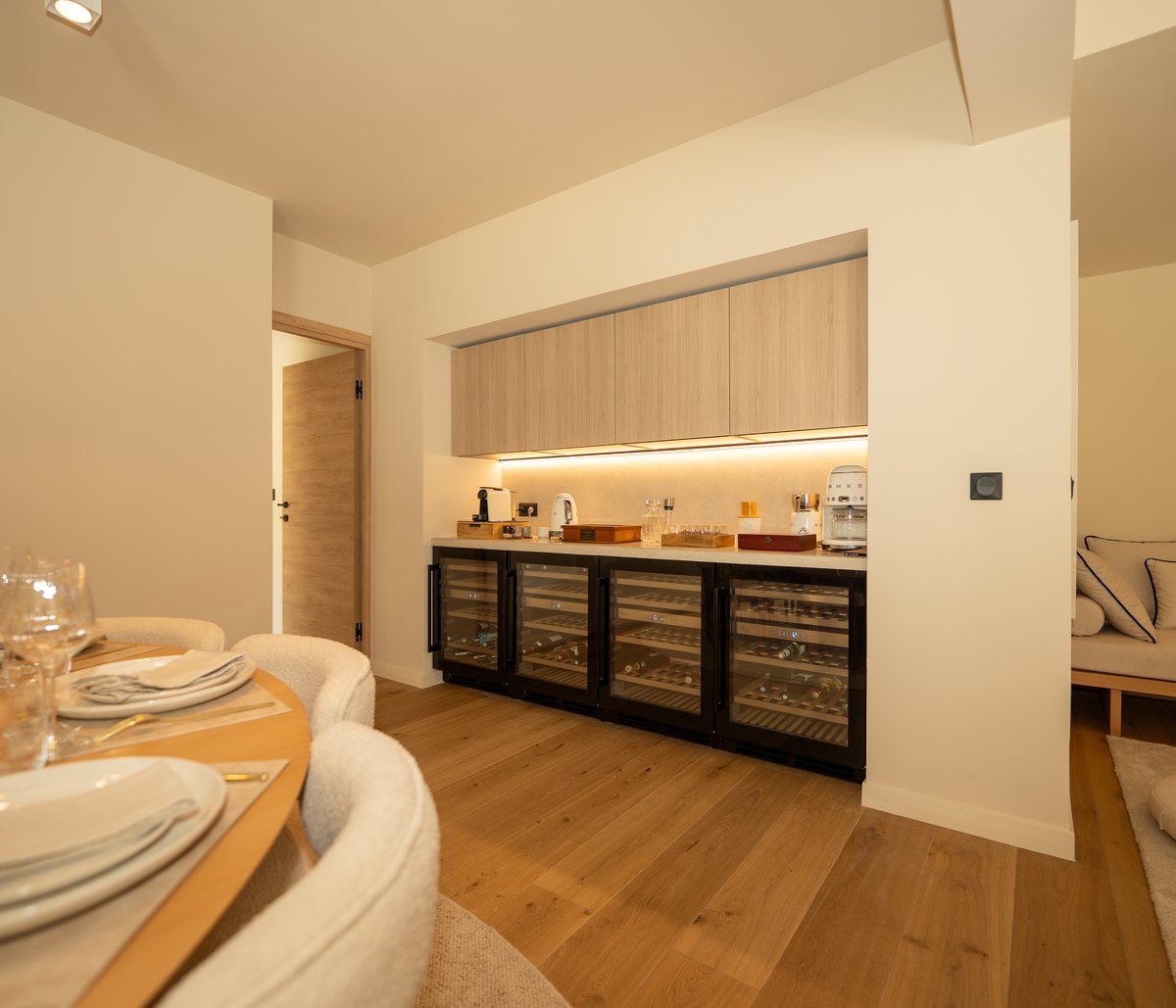 Villa Carpe Diem wine wall — four La Sommelière dual-zone cellars and lounge bar