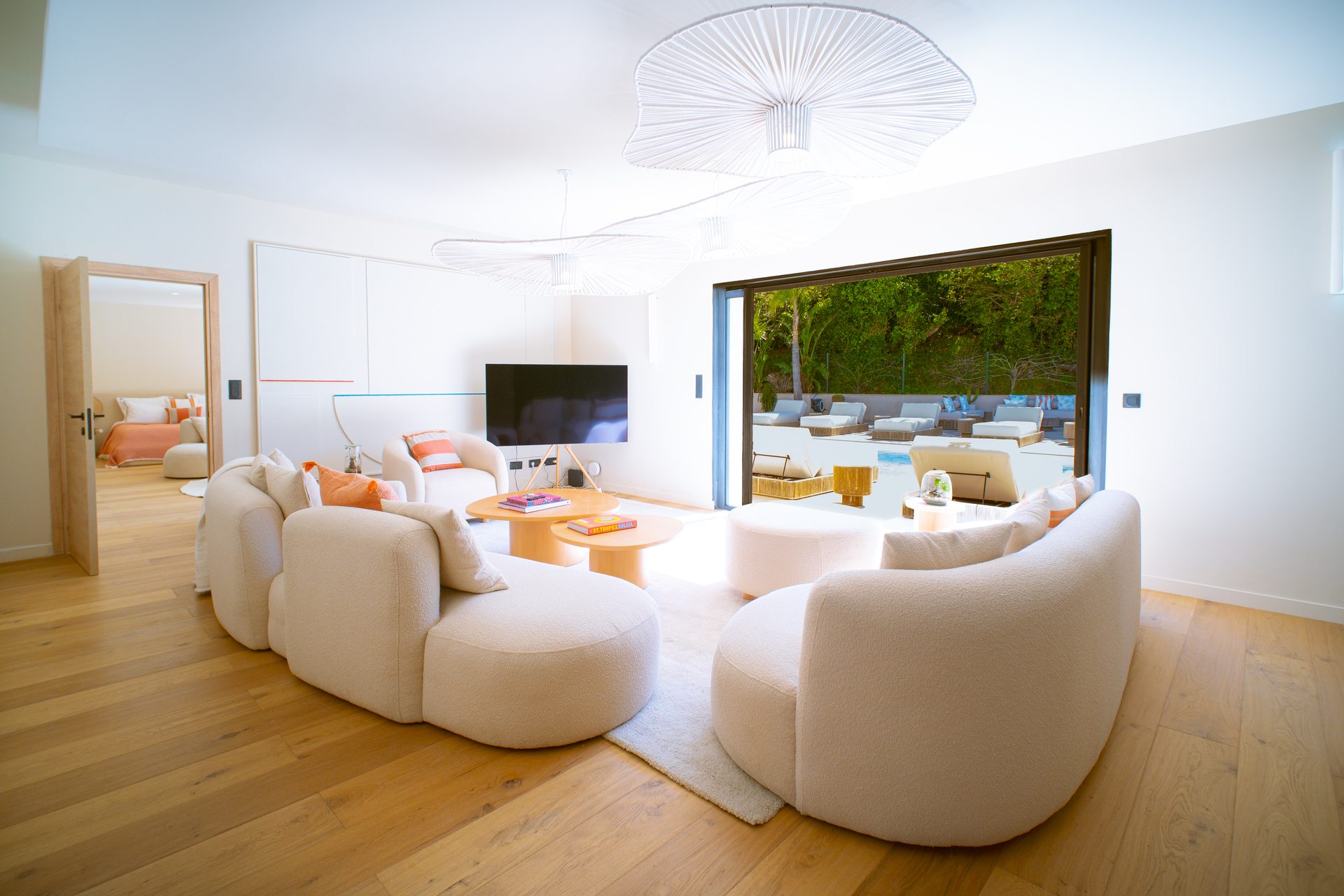 Villa Carpe Diem Grand Salon — Vertigo chandelier, natural oak floors, retractable glass wall
